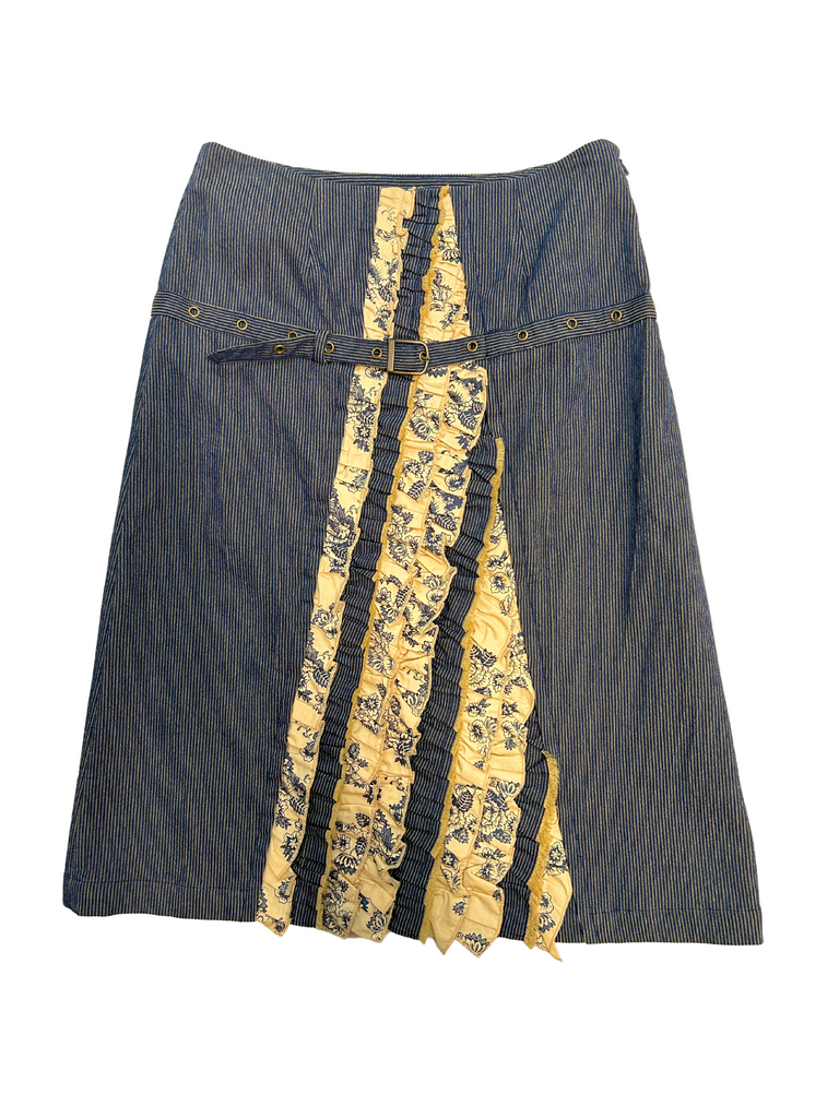 A stylish Frill Coquette midi skirt featuring vertical ruffle detailing and a belt, showcasing a unique blend of pinstripe and floral patterns.