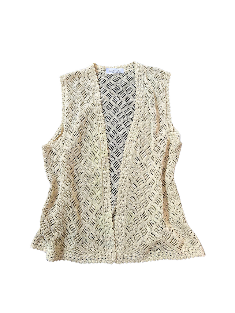 A beige crochet vest with a geometric pattern 