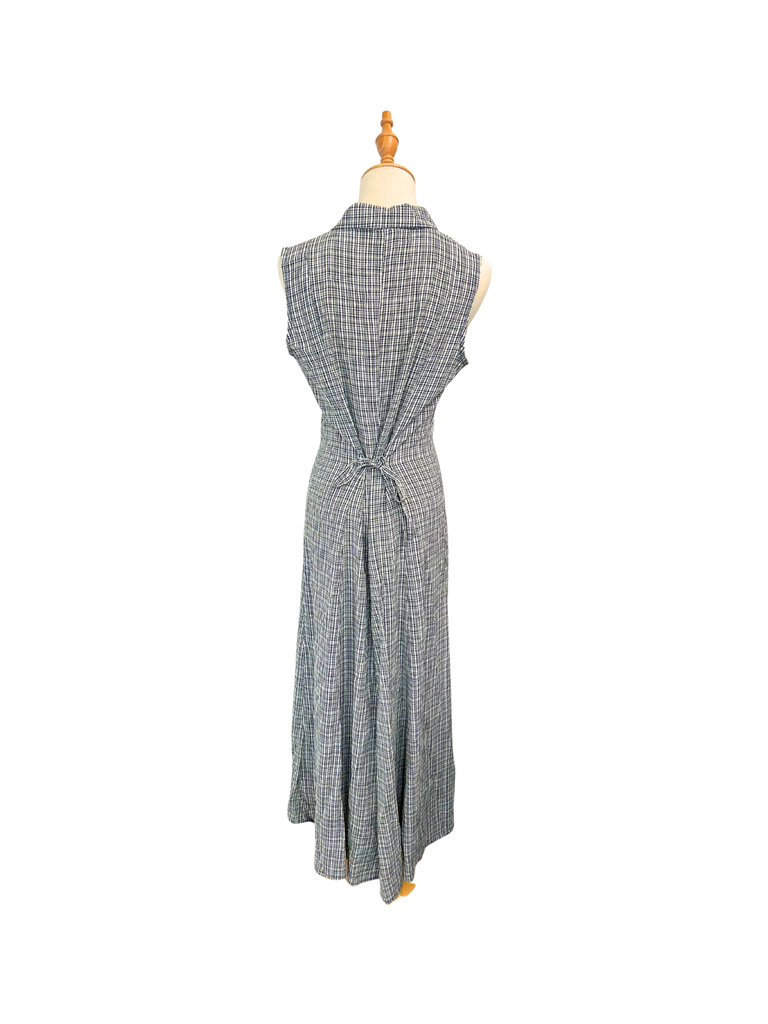 Back view of a Esprit Vintage Gingham Maxi Dress in black and white with white shell buttons and straps for tying around the back