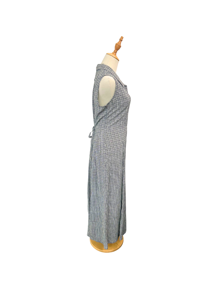 Side view of a Esprit Vintage Gingham Maxi Dress in black and white with white shell buttons and a collar