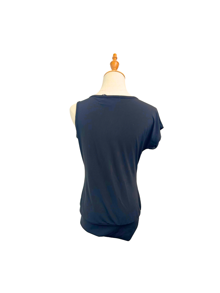 Back view of an Ignite Drop Waist Top in black with a cold shoulder and a sequin detail on strap
