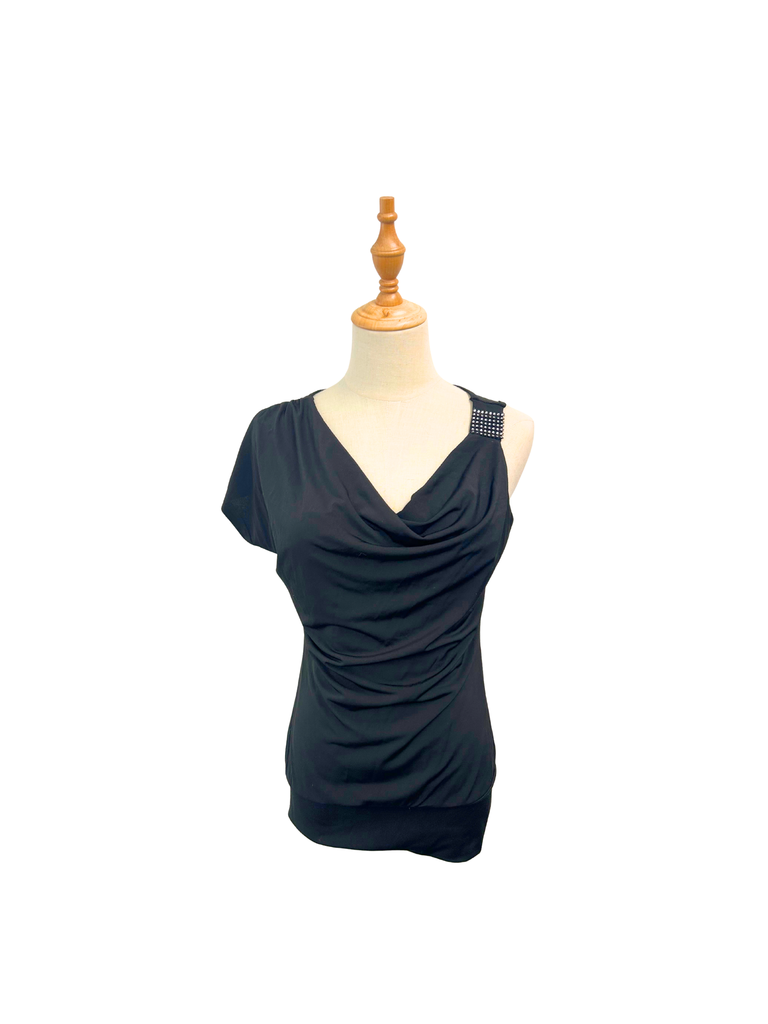 Front view of an Ignite Drop Waist Top in black with a cold shoulder and a sequin detail on strap
