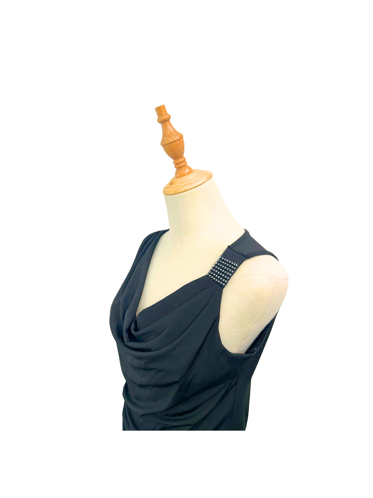 Side view of an Ignite Drop Waist Top in black with a cold shoulder and a sequin detail on strap
