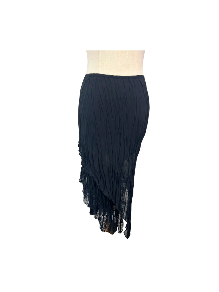 back view of a black Lace Asymmetrical Skirt on a mannequin