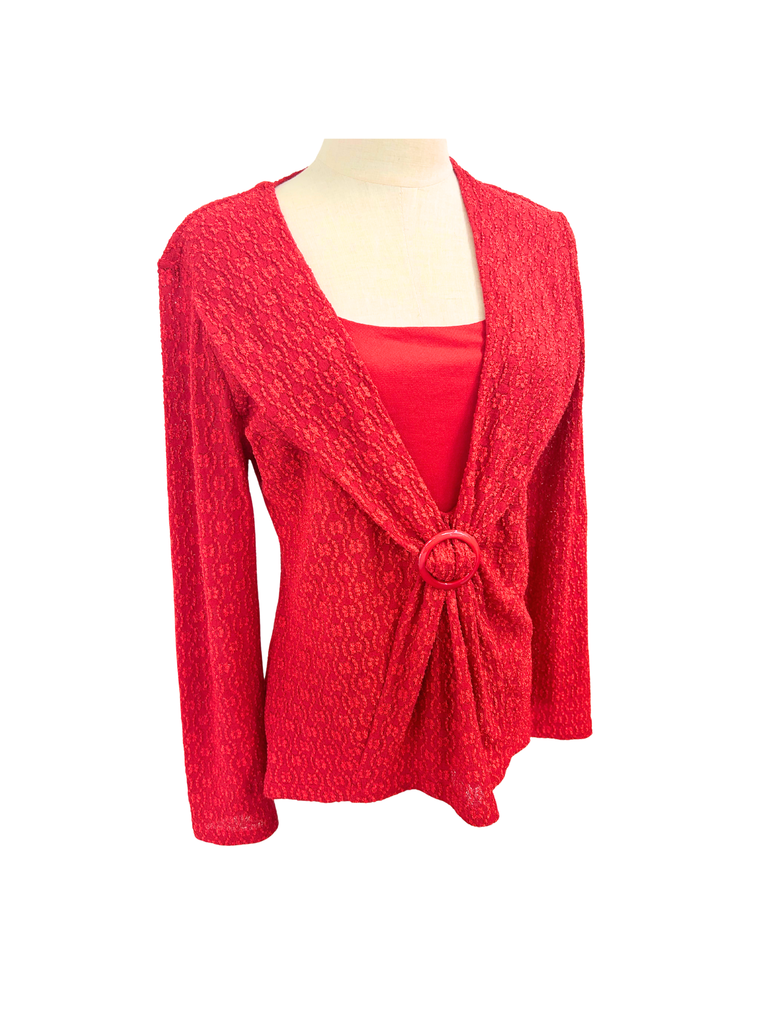 Side view of a STAX Vintage Long Sleeve Top in scarlet red that's made out of all over embroidered fabric and a gathered buckle detail in front
